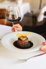 Appetizing steak on a bed of spinach. Foie gras with Madeira sauce © pridneprovskiy