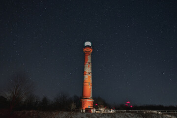Lighthouse in Paldiski peninsula against the backdrop of the starry sky, photo with weak lighting.