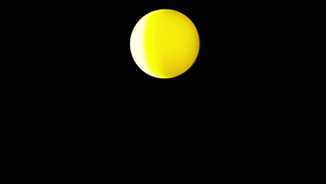 Rotating Yellow Ball or Sphere Flies in Blank Space on a Black Background. Abstract. Plastic ball moves slowly across the screen, and balances in air flow. Levitation. Selective focus. Side lighting.