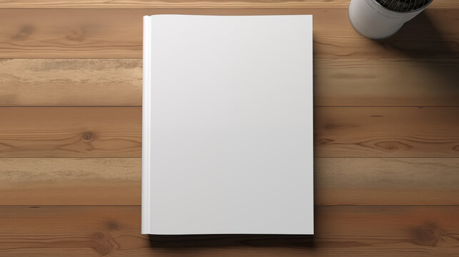 Blank white book cover on a wooden table with coffee cup