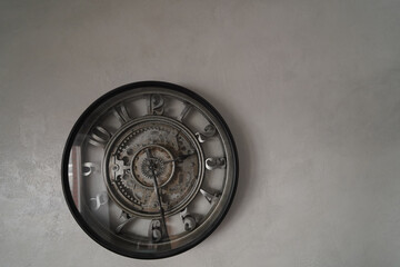 Wall clock on the grey wall