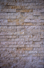 Beige and Orange Limestone Brick Wall.