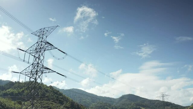 Transmission tower in aerial view. May called electricity pylon, steel utility pole consist of steel structure framing to support carry high-voltage cable or overhead power line for electrical grid.