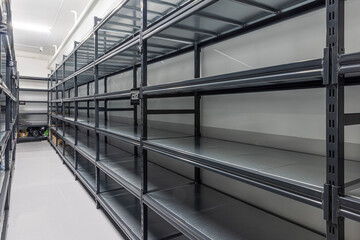 Warehouse racks storage metal pallet racking system in warehouse. Modern interior of new empty...