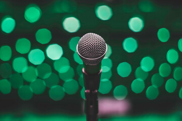 Microphone On The Theater Stage Before The Concert With Green Blurred Lights