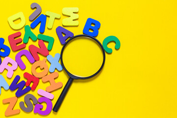 English letters scattered on yellow background. Ideas for developing grammatical thinking and...