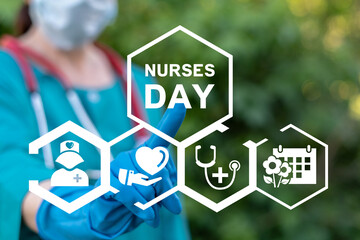Nurse using virtual touch screen presses inscription: NURSES DAY. Concept of international happy nurse day greeting.