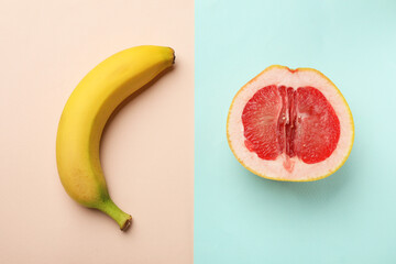 Banana and half of grapefruit on color background, flat lay. Sex concept - obrazy, fototapety, plakaty