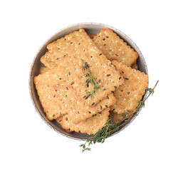 Cereal crackers with flax, sesame seeds and thyme in bowl isolated on white, top view