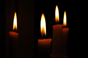 Fototapeta na wymiar Candlelight Glow in Darkness