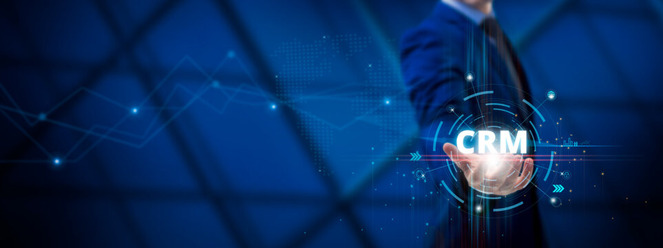 CRM: Customer Relationship Management, Data Analysis, Customer Engagement, Sales Automation, Businessman hold CRM on global structure network and Technological interface.
