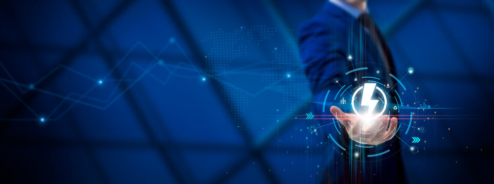Energy Technology: Innovation, Sustainability, Renewable Solutions, Efficiency. Businessman hold Energy Technology Icons on Global Structure Network and Technological Interface.
