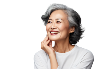 Happy middle aged mature asian woman, senior older 50 year lady looking at camera touching her face isolated on white close up face portrait PNG