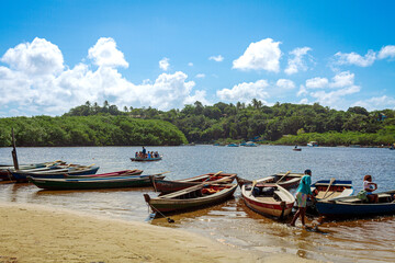 Caraíva, Porto Seguro - Ba. Wooden fishing boats moored in Caraíva, a coastal and riverside community.