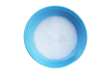 Water dissolved detergent with white foam bubble in blue basin