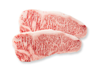 Fresh raw beef steaks set against a white background. Wagyu beef steak.