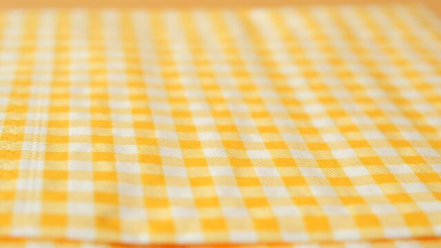  hand pull out a piece of yellow dolor tissue 