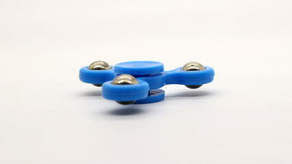 Blue fidget spinner isolated
