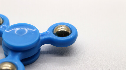 Blue fidget spinner isolated