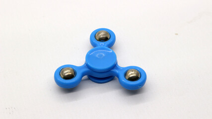 Blue fidget spinner isolated