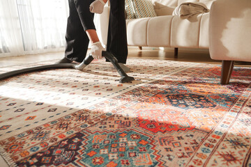 women cleaning with vacuum cleaner carpet,