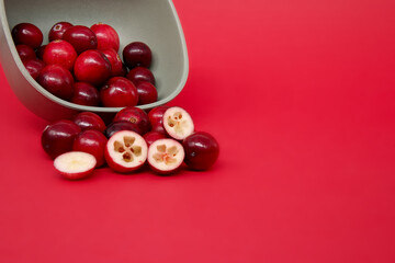 Cranberries against a vibrant red background