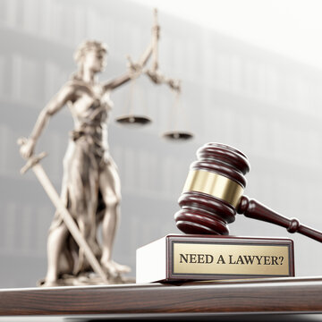 Need a lawyer: Judge's Gavel as a symbol of legal system , Themis is the goddess of justice and wooden stand with text word on the background of books