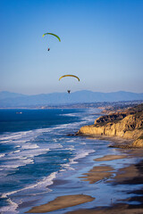 The black beach with paraglider