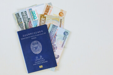 Currency won North Korean currency in cash banknotes of North Korean passports on white background