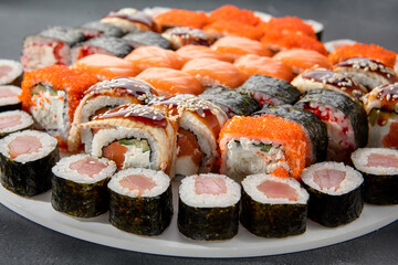 Assorted sushi and maki rolls platter with tuna, salmon, and eel, perfect for a Japanese cuisine experience