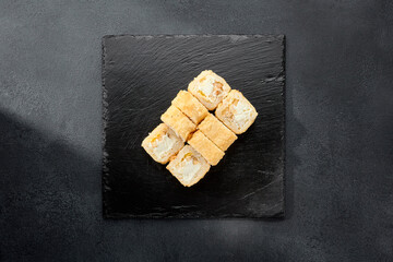 Tempura roll with chicken and cream cheese; a warm fusion roll combining crispy tempura batter with soft, rich flavors