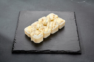 Sweet roll with coconut flakes in a pancake, a delightful fusion of Japanese and Western dessert traditions