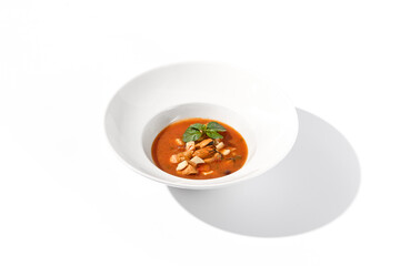 Classic Italian style tomato soup with seafood on white, suited for gourmet blogs and cookbook illustrations