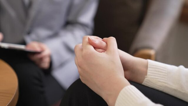 Psychological consult on mental health or seeking help from professional, psychiatrist holding patient's hand on therapy while making diagnostic on mental illness. Mental treatment session. Blithe