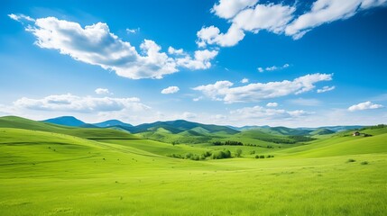 Fototapeta na wymiar Panorama of beautiful countryside of romania. sunny afternoon. wonderful springtime landscape in mountains. grassy field and rolling hills. rural scenery