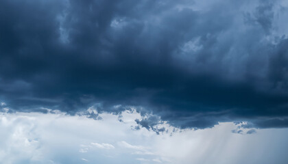 Obraz premium Heavy rainfall close up. Dark blue Gloomy sky with stormy clouds in rain. Nature Dramatic Sky Background, texture for Design. Artistic Panoramic Wallpaper or Web banner With Copy Space