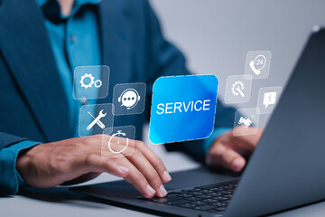 Technical support customer service concept, call center and customer service help. Businessman use laptop with support customer icon on virtual screen.