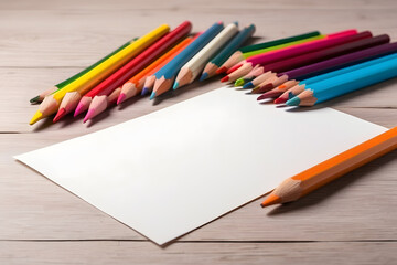 A blank white sheet and coloured pencils for drawing on a plain textured background design with space for copying and lettering design.
