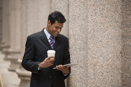 Indian Businessman Using Digital Tablet Computer.