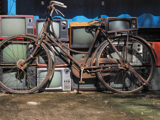 Fototapeta na wymiar Old rusty bicycle moped with old TV