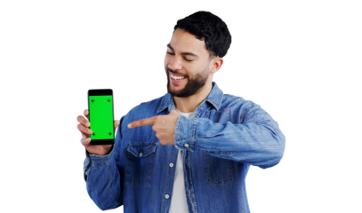 Happy, man or pointing to phone with green screen for advertising presentation, mockup space and coming soon. Smile, indian influencer or show with hand gesture isolated on png transparent background