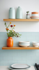Fototapeta na wymiar A minimalist kitchen with open shelves, a pastel blue subway tile backsplash, and a touch of bright orange in the accessories.