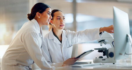 Scientist, women and teamwork on tablet and computer for laboratory advice, medical research and...
