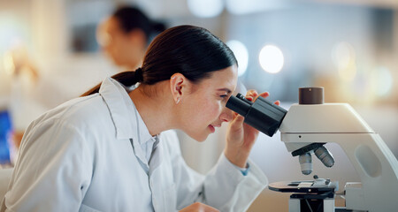 Science, research and woman with microscope, tablet and biotech data report in laboratory. Medical...