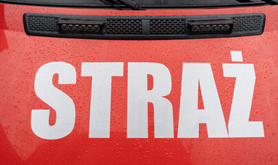 Fire brigade truck with the word Straż, which means fire department. Fire engine service in...