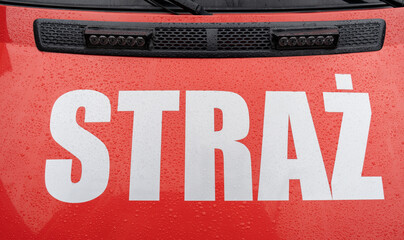 Fire brigade truck with the word Straż, which means fire department. Fire engine service in Poland, firefighters car, Polish fireman vehicle. © Longfin Media