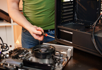 Close up of man repairing computer system unit