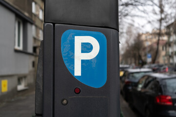 Parking meter, Parkometr or Parkomat in paid parking zone of city centre downtown district. Car...