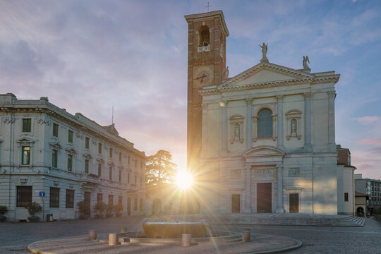 Historic center of an Italian city at sunrise. Gallarate, square della Libert&agrave; with the Basilica of Santa Maria Assunta, On the left is the town hall. City in the province of Varese, Lombardy, Italy