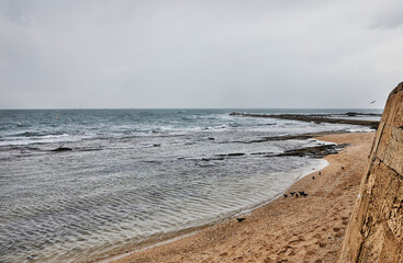 Fototapeta na wymiar Majestic seashore with waves crashing on the Mediterranean pier